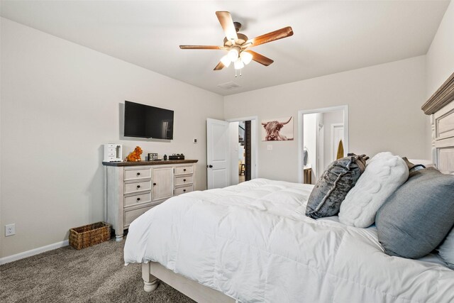 carpeted bedroom featuring baseboards, a ceiling fan, and visible vents