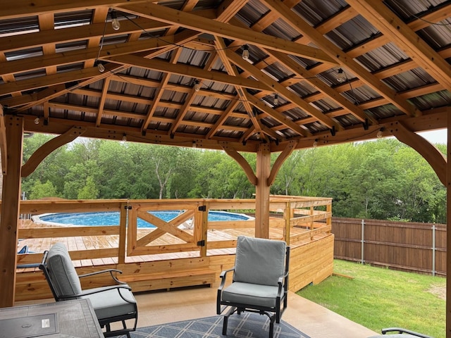 view of patio / terrace with a gazebo, fence, and a deck