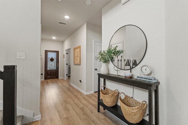foyer featuring baseboards, recessed lighting, visible vents, and light wood-type flooring
