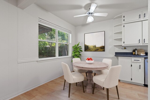 dining area with light wood-style flooring
