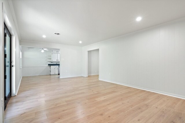 unfurnished living room with recessed lighting, visible vents, ornamental molding, and light wood-style floors