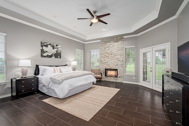 bedroom featuring crown molding, baseboards, access to exterior, and a raised ceiling