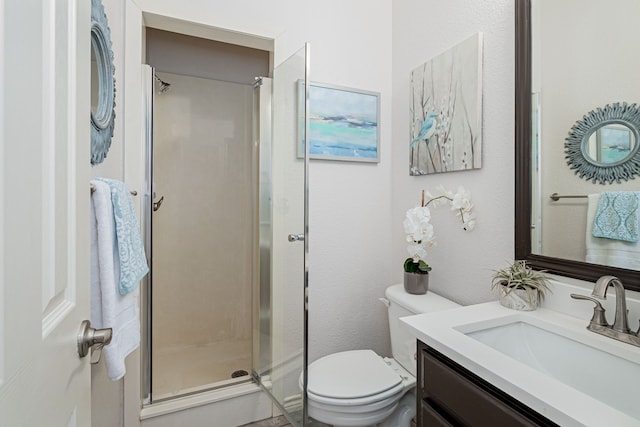 full bathroom with double vanity, a sink, shower / bath combo with shower curtain, and toilet