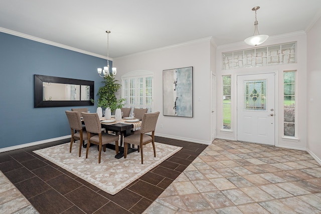 dining space featuring crown molding, baseboards, and an inviting chandelier