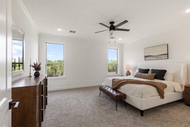 carpeted bedroom with visible vents, recessed lighting, baseboards, and crown molding