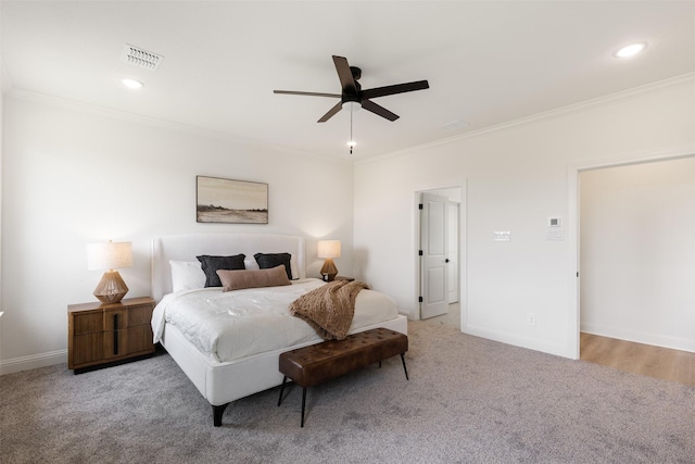 carpeted bedroom with recessed lighting, baseboards, visible vents, and ornamental molding