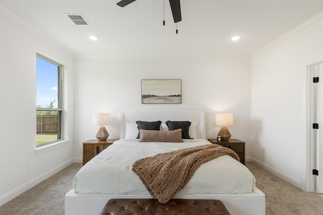 carpeted bedroom featuring baseboards, multiple windows, and visible vents