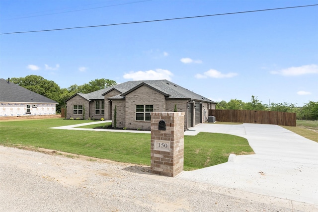 view of front of home featuring fence, brick siding, a garage, a front yard, and concrete driveway
