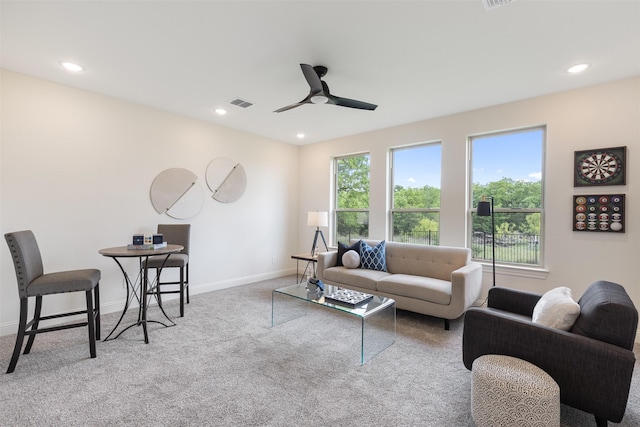 carpeted living area featuring visible vents, recessed lighting, baseboards, and ceiling fan