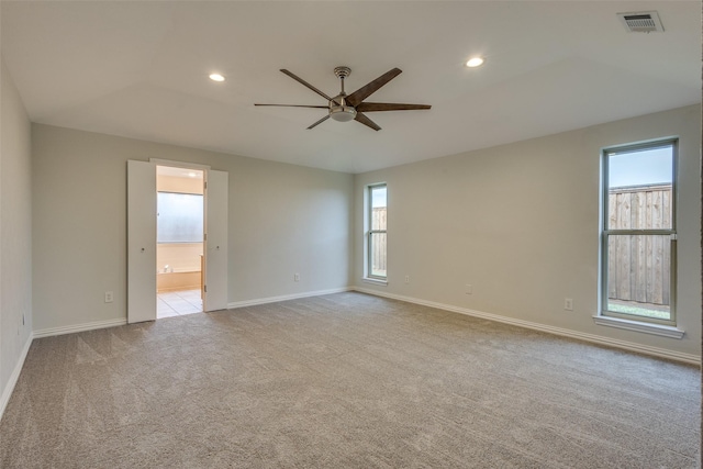 spare room featuring ceiling fan, carpet floors, recessed lighting, baseboards, and visible vents