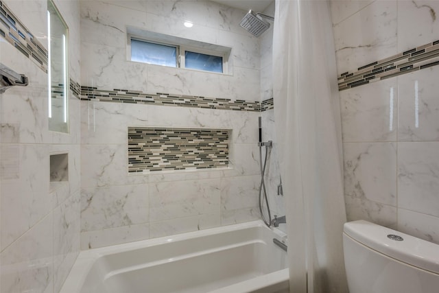 bathroom featuring shower / bath combo with shower curtain and toilet