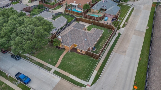 birds eye view of property with a residential view