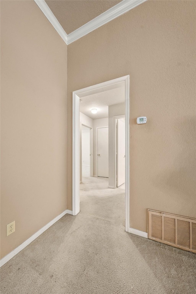 3133 Chimney Hill Dr, Waco, TX 76708 - hallway featuring carpet flooring, baseboards, visible vents, and ornamental molding