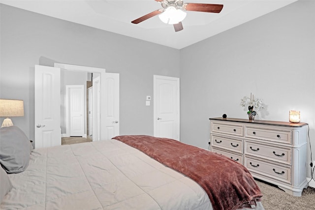 bedroom featuring ceiling fan and carpet