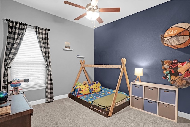 carpeted bedroom with baseboards and ceiling fan