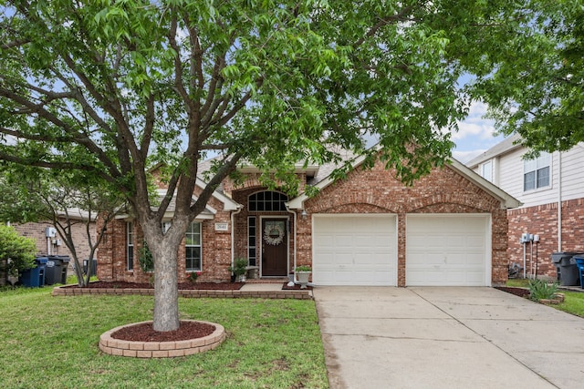 traditional home with concrete driveway, brick siding, an attached garage, and a front lawn