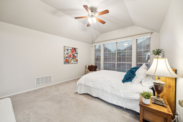 bedroom featuring visible vents, baseboards, ceiling fan, carpet flooring, and vaulted ceiling