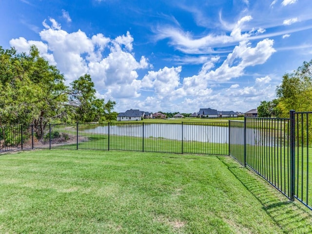 261 Chisholm Ranch Dr, Rockwall, TX 75032 - view of yard featuring a water view, fence, and a residential view