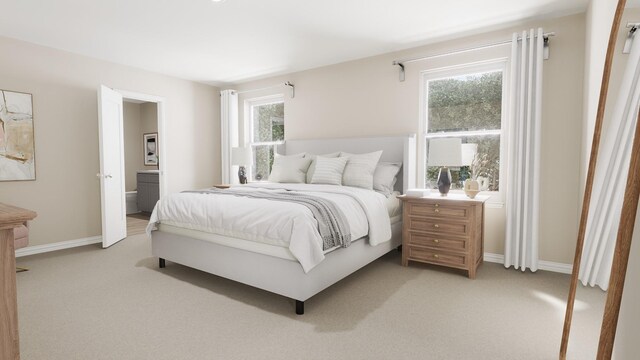 bedroom with baseboards and light colored carpet