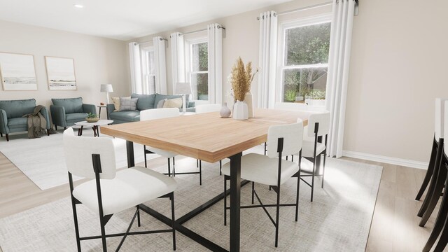 dining space featuring light wood-style floors, recessed lighting, and baseboards