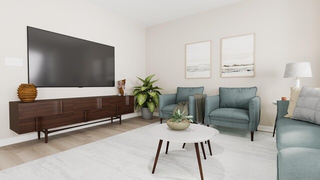 living area with baseboards and wood finished floors