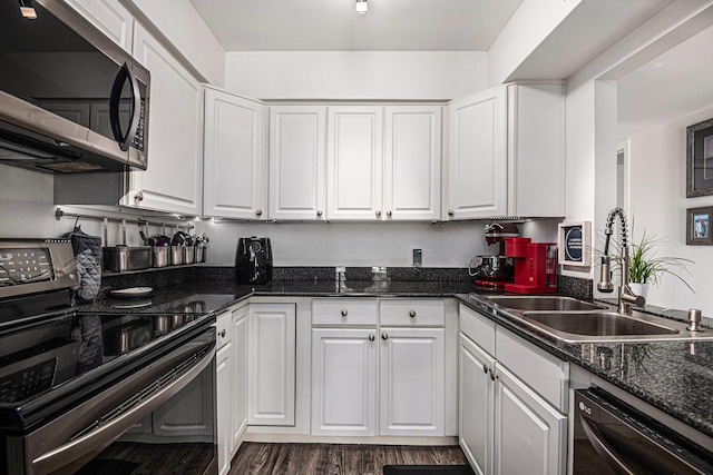 672 Harbor Dr, Azle, TX 76020 - kitchen with stainless steel microwave, electric stove, dishwasher, a sink, and white cabinets