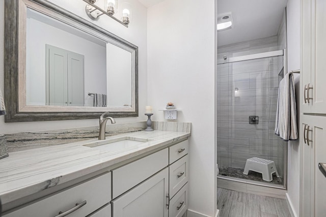 672 Harbor Dr, Azle, TX 76020 - full bathroom featuring vanity, a stall shower, and baseboards