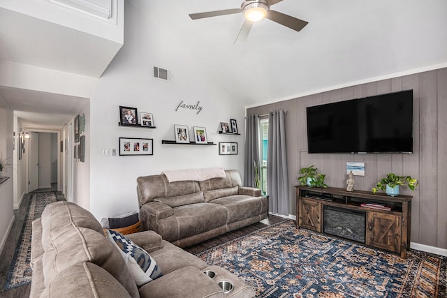 672 Harbor Dr, Azle, TX 76020 - living room featuring a ceiling fan, baseboards, and wood walls