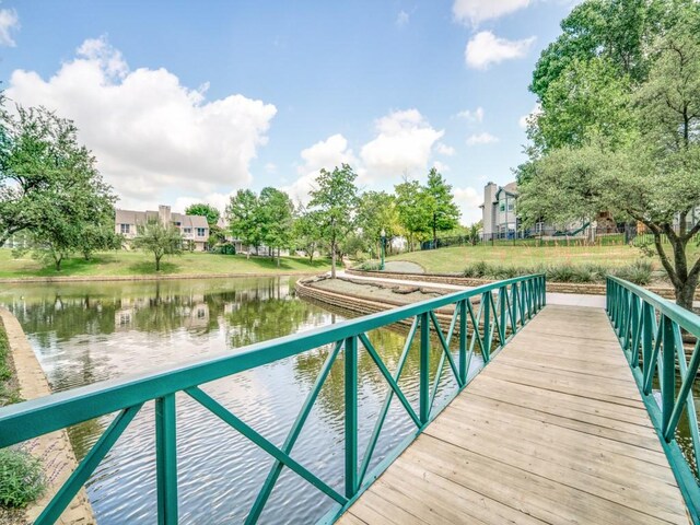 dock area with a water view