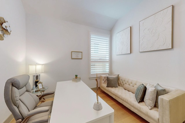 office area featuring vaulted ceiling and wood finished floors