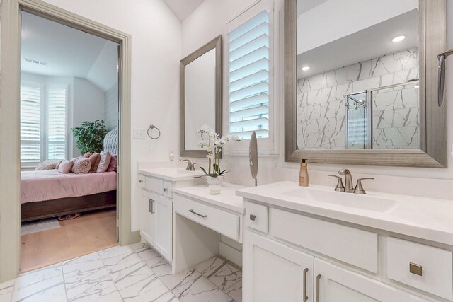 full bath with ensuite bath, a sink, marble finish floor, a marble finish shower, and recessed lighting