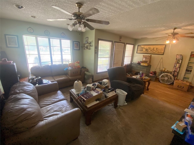 10721 Hermosa Dr, Dallas, TX 75218 - living area featuring a ceiling fan and a textured ceiling
