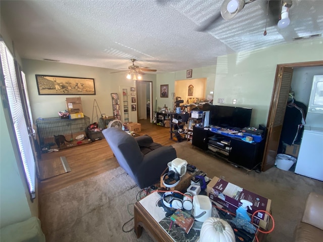 10721 Hermosa Dr, Dallas, TX 75218 - living room featuring a ceiling fan, a textured ceiling, and wood finished floors