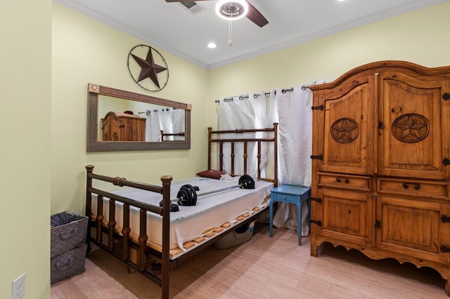 bedroom with ceiling fan, visible vents, crown molding, light wood finished floors, and recessed lighting