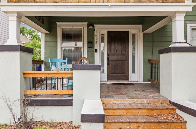 property entrance with covered porch