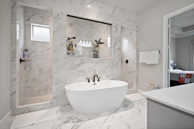 2308 Topaz Dr, Rockwall, TX 75087 - ensuite bathroom featuring a walk in shower, a freestanding tub, marble finish floor, and vanity