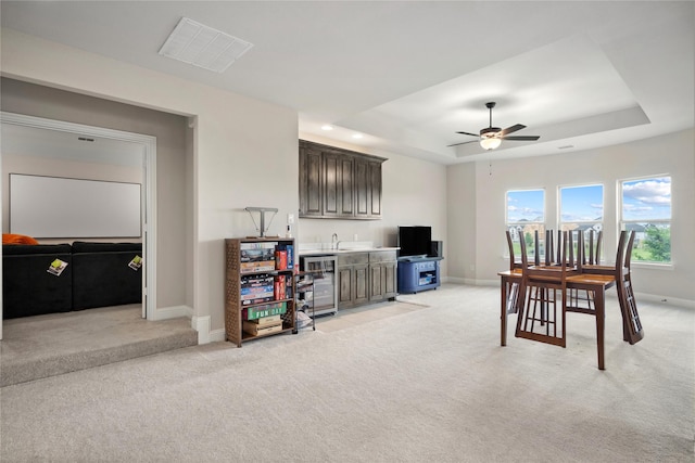 2308 Topaz Dr, Rockwall, TX 75087 - interior space featuring visible vents, wine cooler, light carpet, indoor wet bar, and ceiling fan