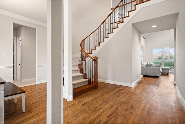 2308 Topaz Dr, Rockwall, TX 75087 - stairway with crown molding, recessed lighting, baseboards, and wood finished floors