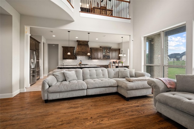 2308 Topaz Dr, Rockwall, TX 75087 - living room with recessed lighting, dark wood-style flooring, and a towering ceiling