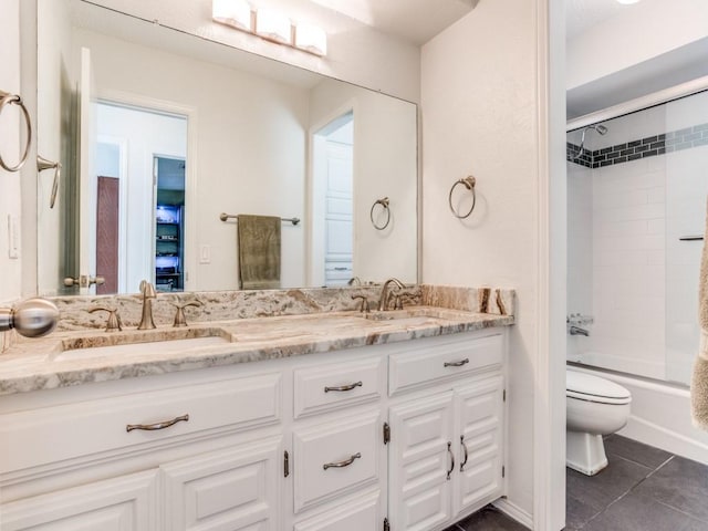 full bathroom featuring toilet, double vanity, tile patterned floors, and  shower combination