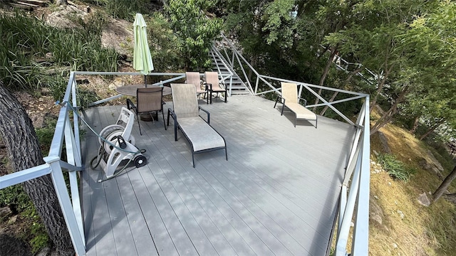 407 S Lakewood Cir, Lake Bridgeport, TX 76426 - deck with outdoor dining area and stairway