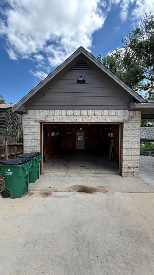 407 S Lakewood Cir, Lake Bridgeport, TX 76426 - garage with concrete driveway and fence
