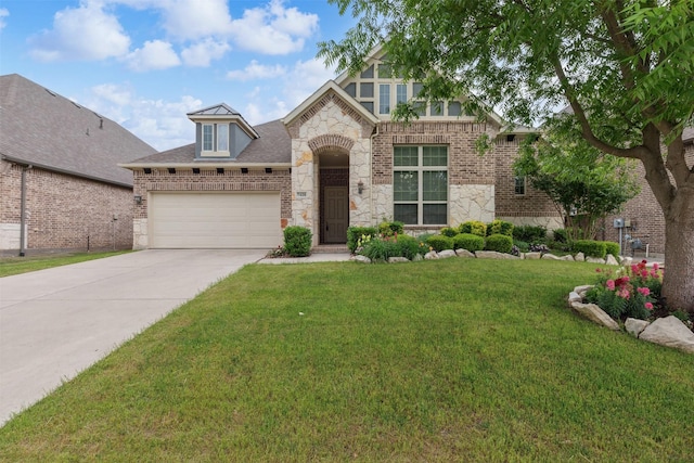 view of front of house with concrete driveway, a front yard, stone siding, and a garage