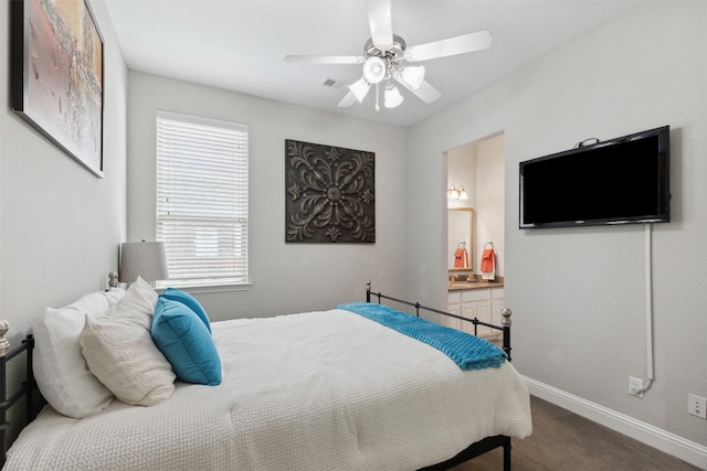 bedroom featuring carpet flooring, baseboards, ceiling fan, and connected bathroom