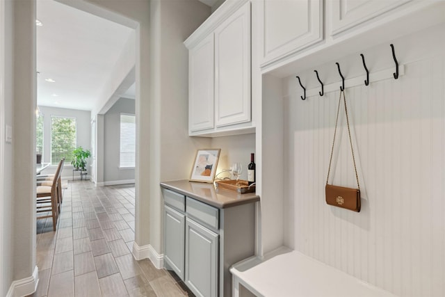 mudroom with baseboards and recessed lighting