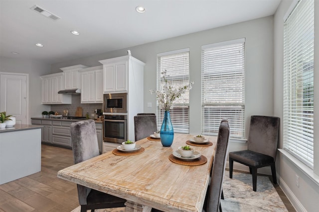dining space with plenty of natural light, recessed lighting, and visible vents