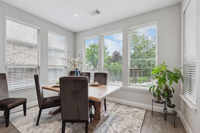 dining space with recessed lighting, baseboards, visible vents, and wood finished floors