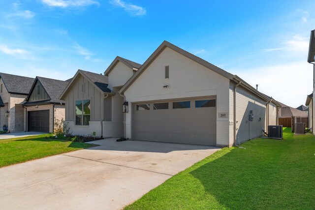 ranch-style house with a garage, driveway, a front lawn, and brick siding