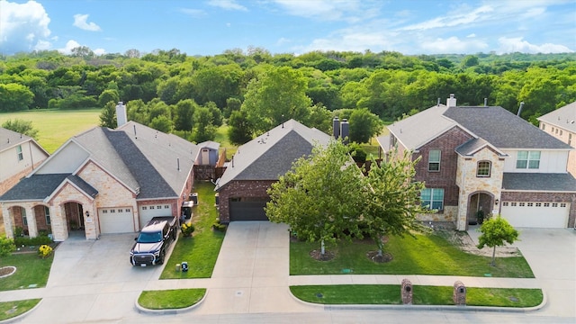 aerial view featuring a wooded view