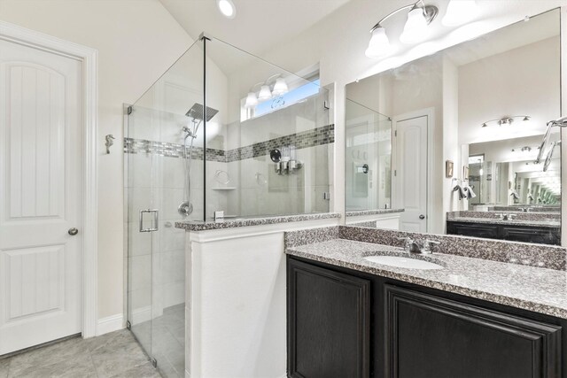 bathroom with vanity and a stall shower